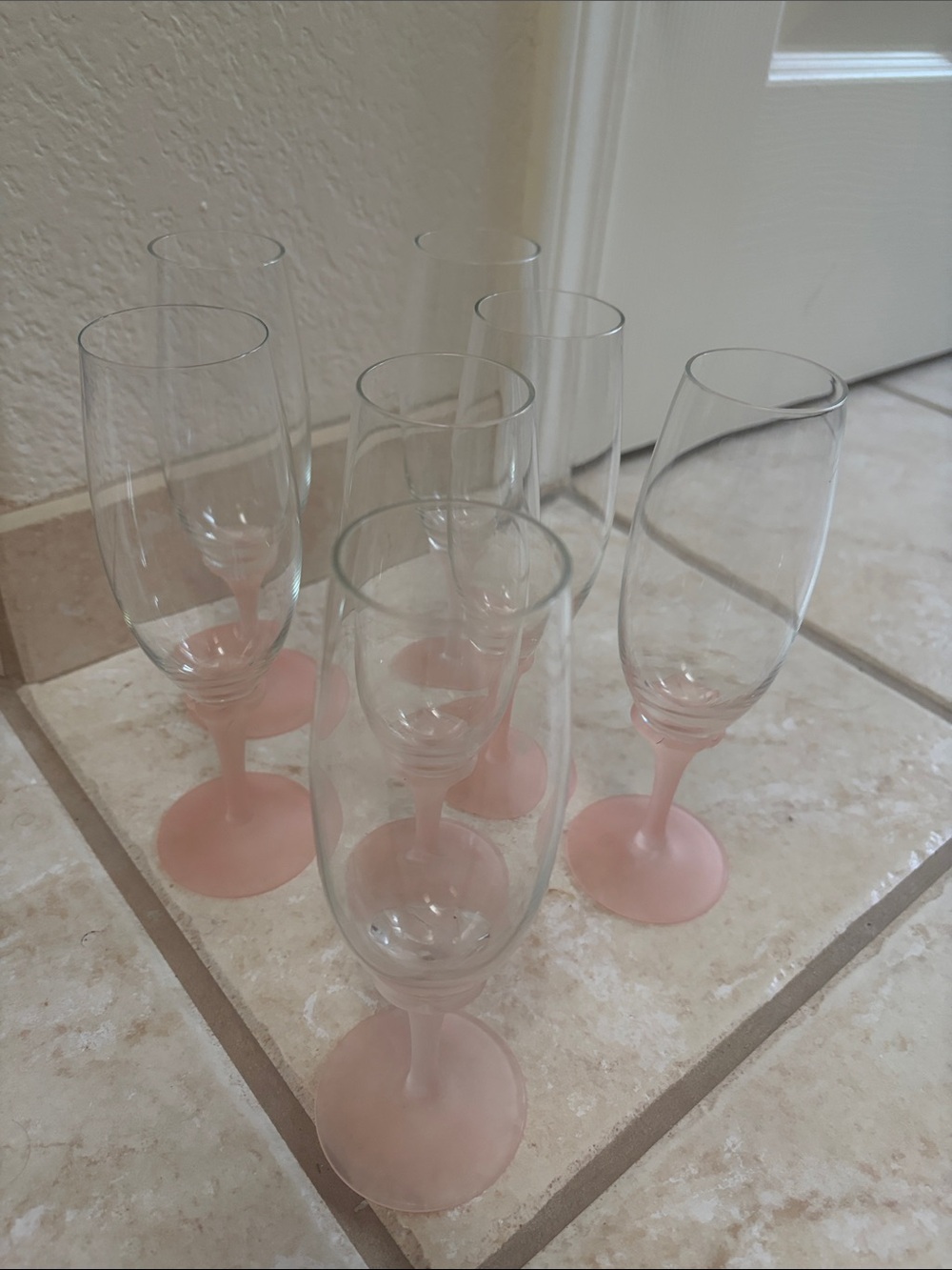 Set of 7 Frosted Pink Stemmed Champagne Flutes.
